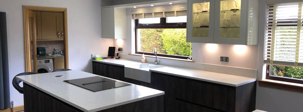 Modern kitchen renovation featuring bespoke hidden storage cabinets and integrated appliances in a minimalist home